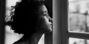 Mom looking out rainy window