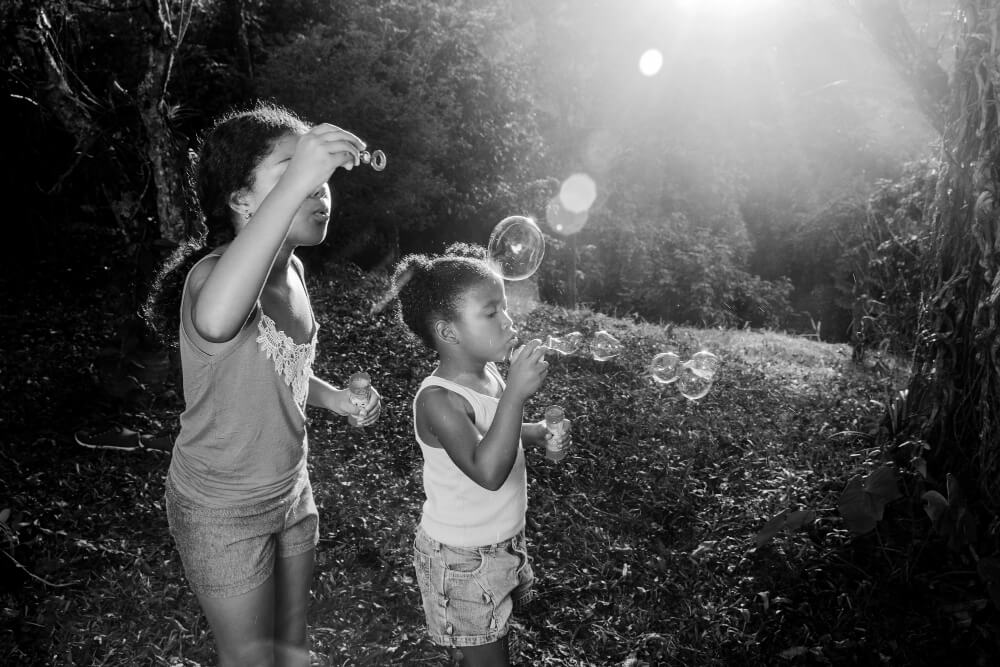 girls blowing bubbles